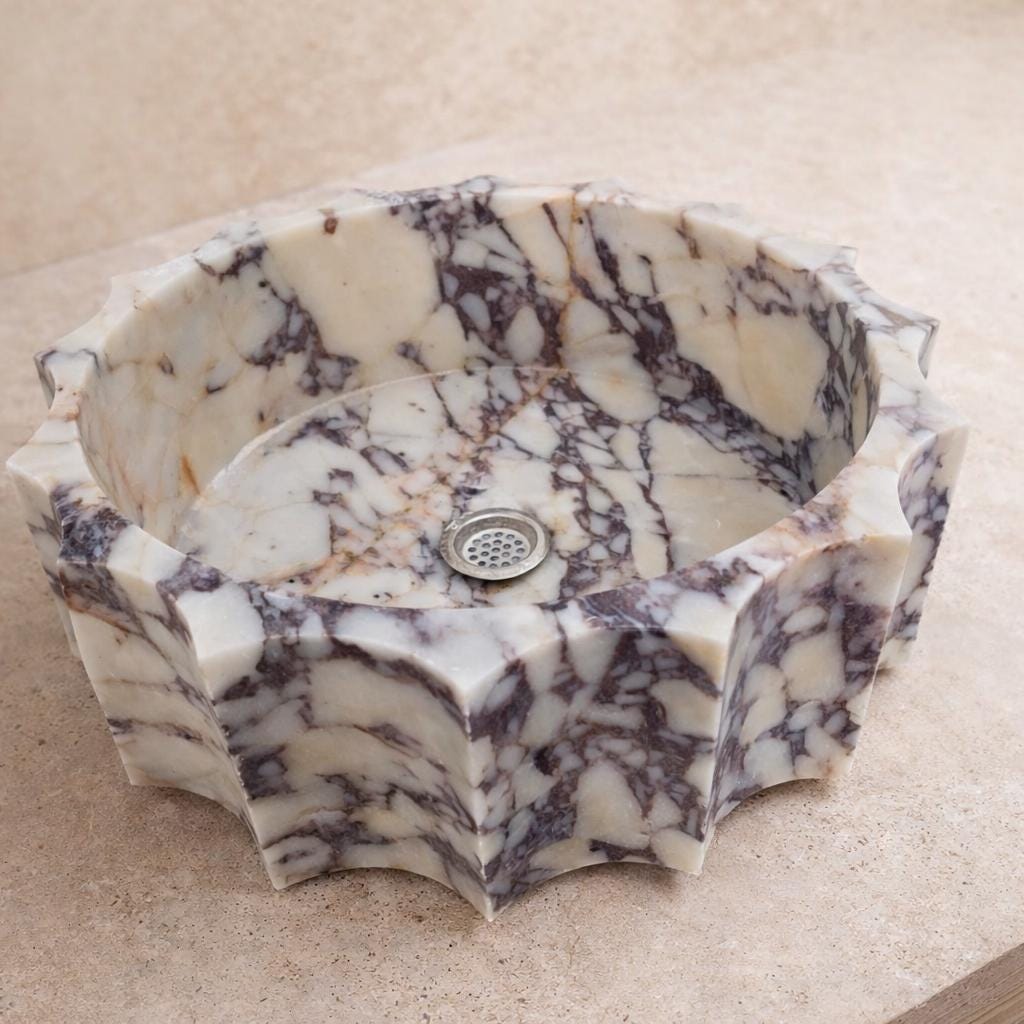 Hand-carved Calacatta viola marble basin